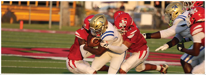 A football player is sliding on the ground. Description generated by AI