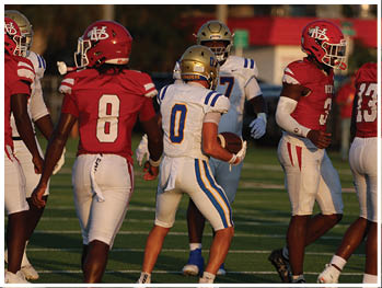 A football player is sliding on the ground. Description generated by AI
