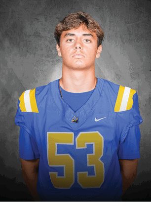 A young man wearing a white and black jersey with the number 14 on it. Description generated by AI