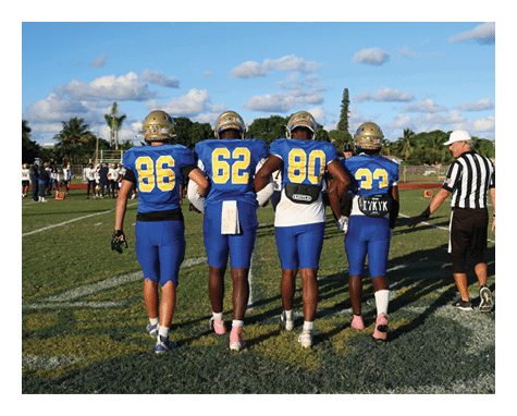 A group of young men wearing black jerseys with the word “Vista" on the front are celebrating a victory. AI generated content