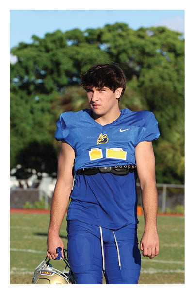 A football player wearing a black and white uniform with the number 10 on the back. AI generated content