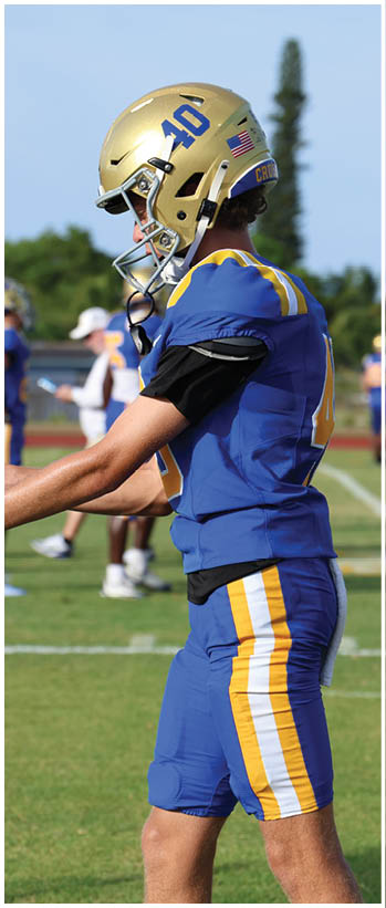 A football player running on the field. Description generated by AI