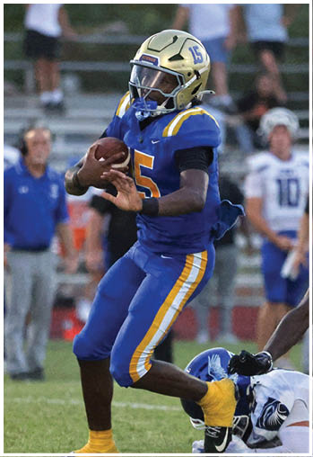 A football player running on the field. Description generated by AI