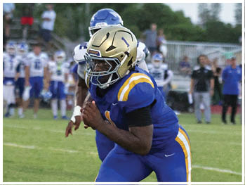 A football player is sliding on the ground. Description generated by AI