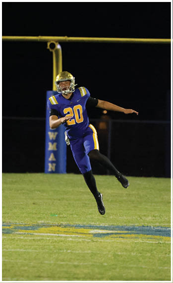 A football player running on the field. Description generated by AI
