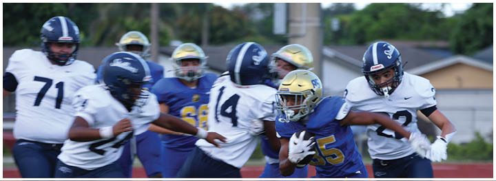 A football player is sliding on the ground. Description generated by AI