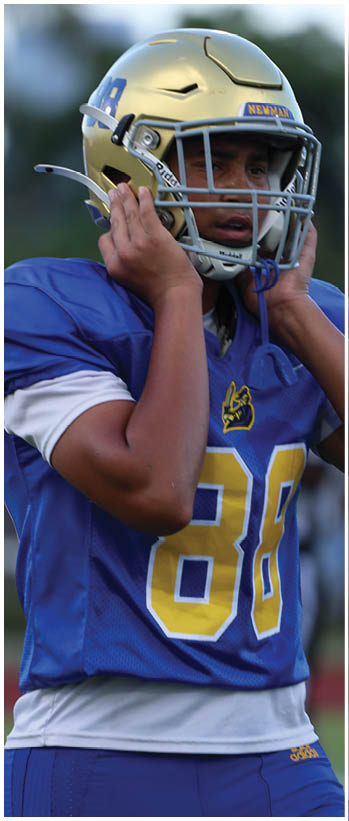 A football player running on the field. Description generated by AI