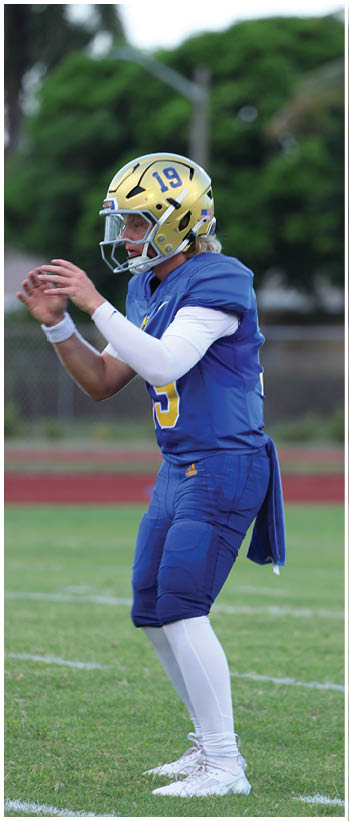 A football player running on the field. Description generated by AI