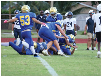 A football player is sliding on the ground. Description generated by AI