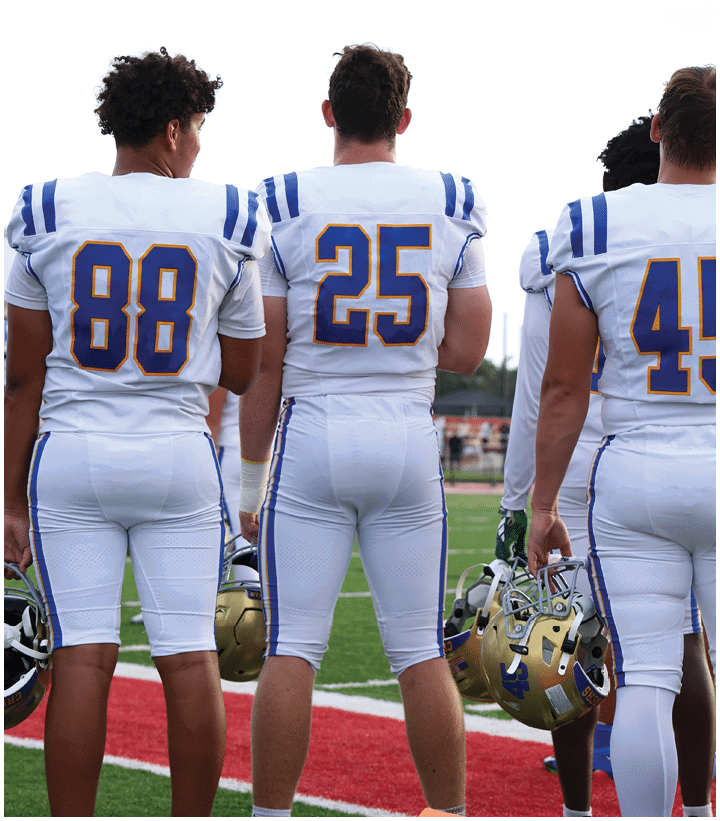 A group of football players wearing black and white uniforms. Description generated by AI