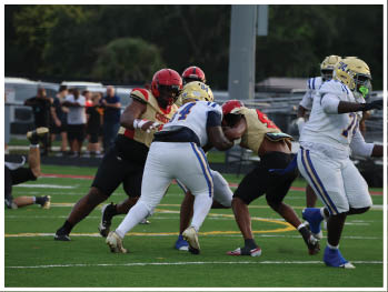 A football player is sliding on the ground. Description generated by AI