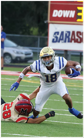 A football player running on the field. Description generated by AI