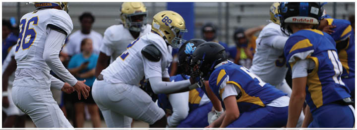 A football player is sliding on the ground. Description generated by AI