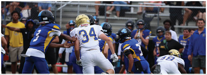 A football player is sliding on the ground. Description generated by AI