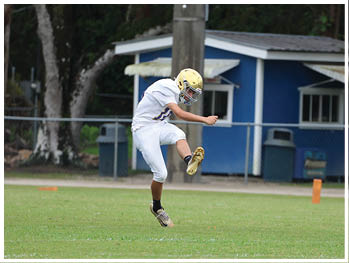 A football player is sliding on the ground. Description generated by AI