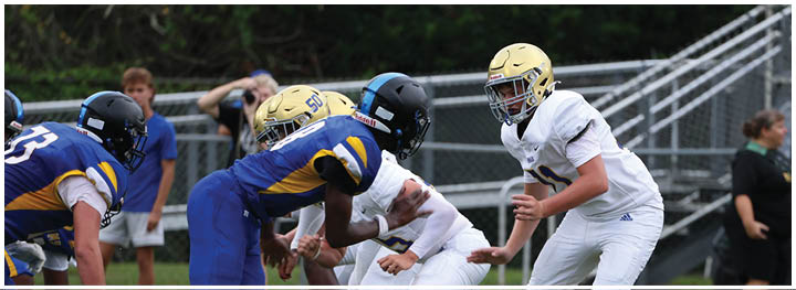 A football player is sliding on the ground. Description generated by AI