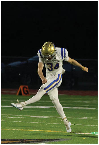 A football player running on the field. Description generated by AI