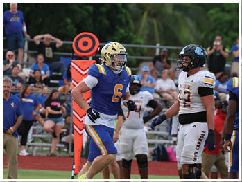 A football player is sliding on the ground. Description generated by AI