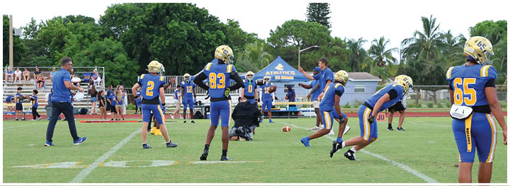 A football player is sliding on the ground. Description generated by AI