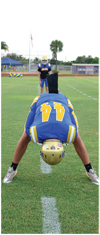 A football player running on the field. Description generated by AI