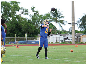 A football player is sliding on the ground. Description generated by AI