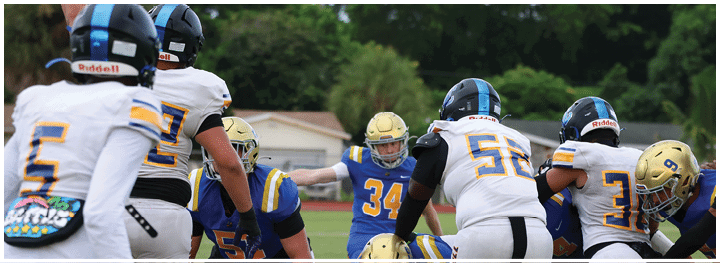 A football player is sliding on the ground. Description generated by AI