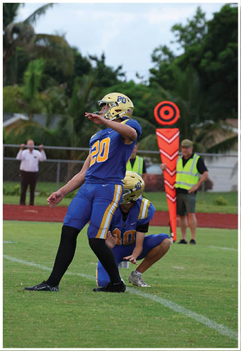 A football player running on the field. Description generated by AI