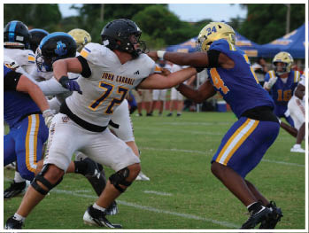 A football player is sliding on the ground. Description generated by AI