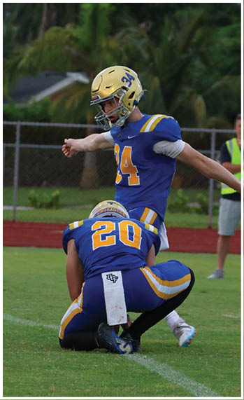 A football player running on the field. Description generated by AI