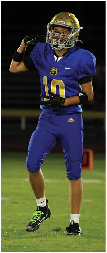 A football player running on the field. Description generated by AI