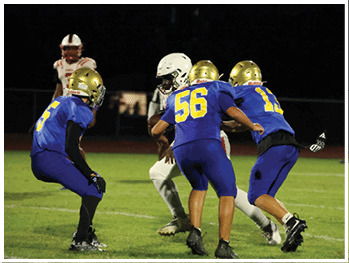 A football player is sliding on the ground. Description generated by AI