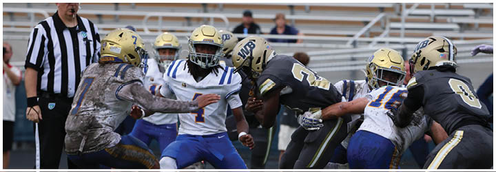 A group of football players on a field. Description generated by AI