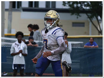A football player is sliding on the ground. Description generated by AI