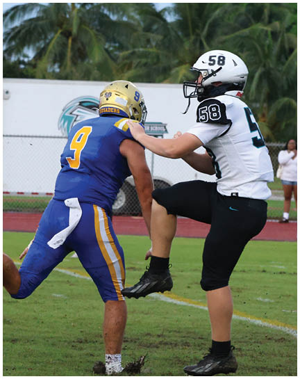 A football player wearing a blue and white uniform. Description generated by AI