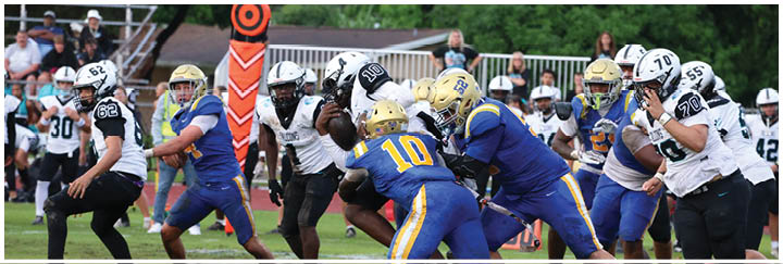 A group of football players on a field. Description generated by AI