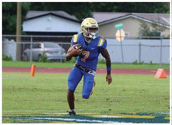 A football player is sliding on the ground. Description generated by AI