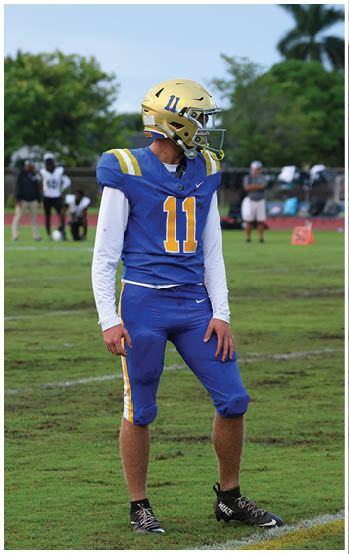 A football player running on the field. Description generated by AI