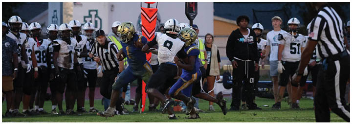 A football player is sliding on the ground. Description generated by AI