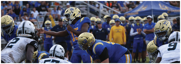 A football player is sliding on the ground. Description generated by AI