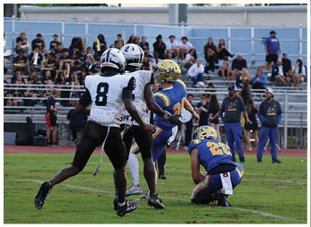 A football player is sliding on the ground. Description generated by AI