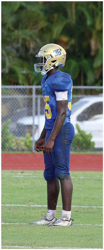 A football player running on the field. Description generated by AI