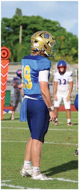 A football player running on the field. Description generated by AI