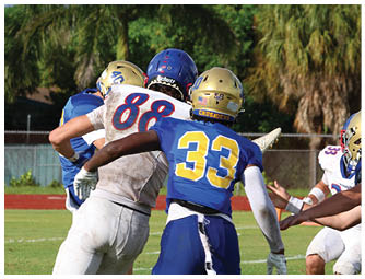 A football player is sliding on the ground. Description generated by AI