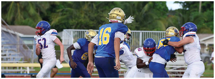 A football player is sliding on the ground. Description generated by AI