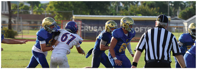A group of football players on a field. Description generated by AI