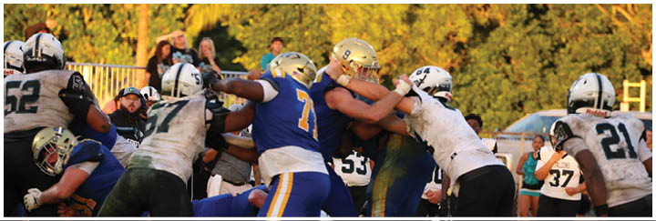 A group of football players on a field. Description generated by AI