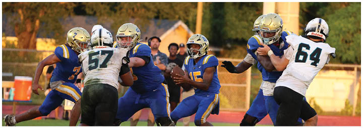 A football player is sliding on the ground. Description generated by AI