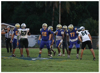 A football player is sliding on the ground. Description generated by AI