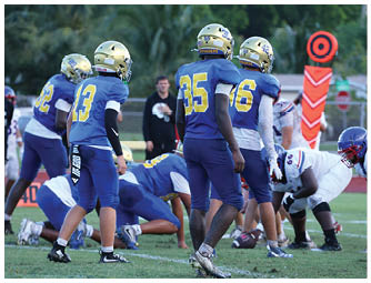 A football player is sliding on the ground. Description generated by AI