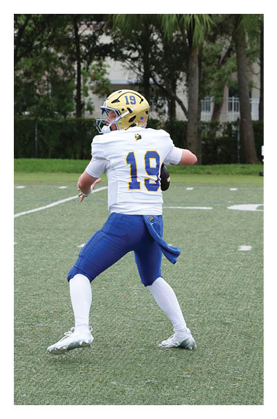 A young man wearing a football jersey with the name Vista on the back. AI generated content